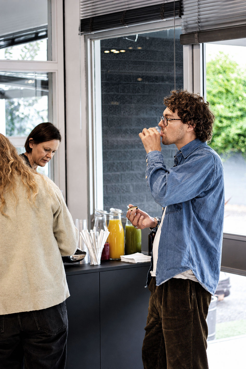 UNIT team member serving hydration drinks at Matrix Studios